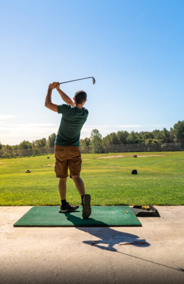 Young man playing golf in summer. Unrecognizable person. High quality photo